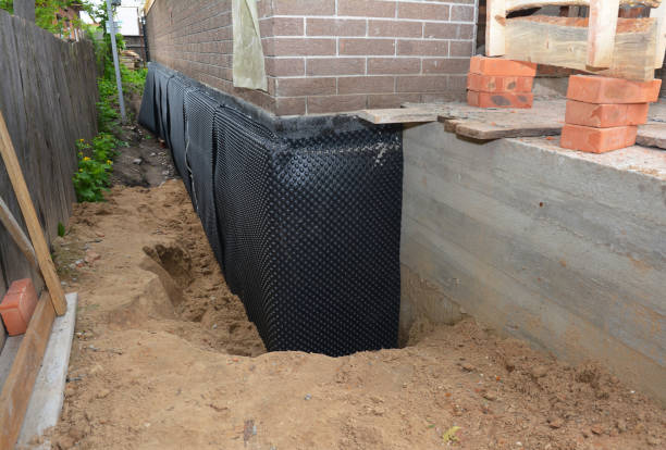 Happy homeowners after waterproofing job in Vinemont